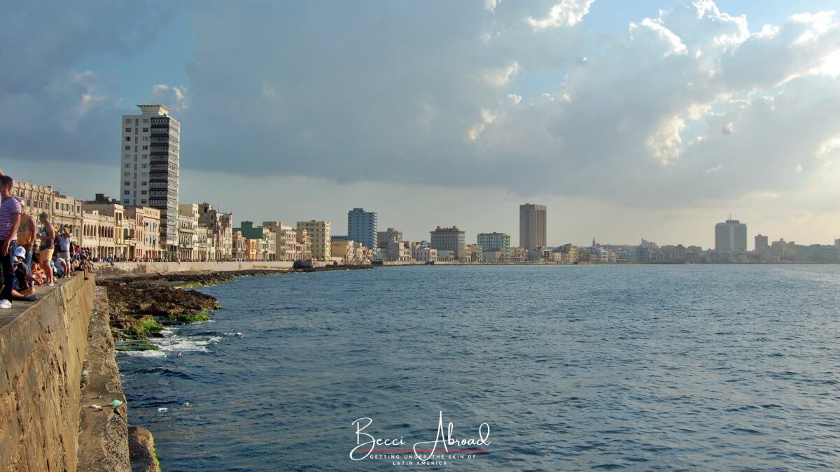 The Malecón ocean drive in Havana at sunset where locals gather to spend time together with friends and family