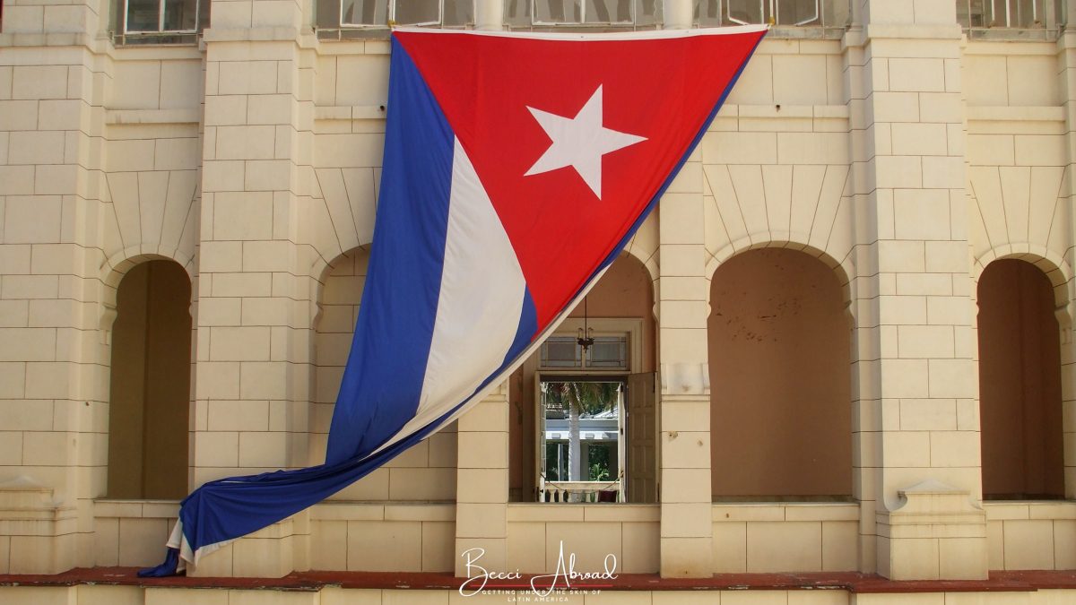 The Cuban flag hanging on the Revolution Museum, one of the best places to visit in Havana