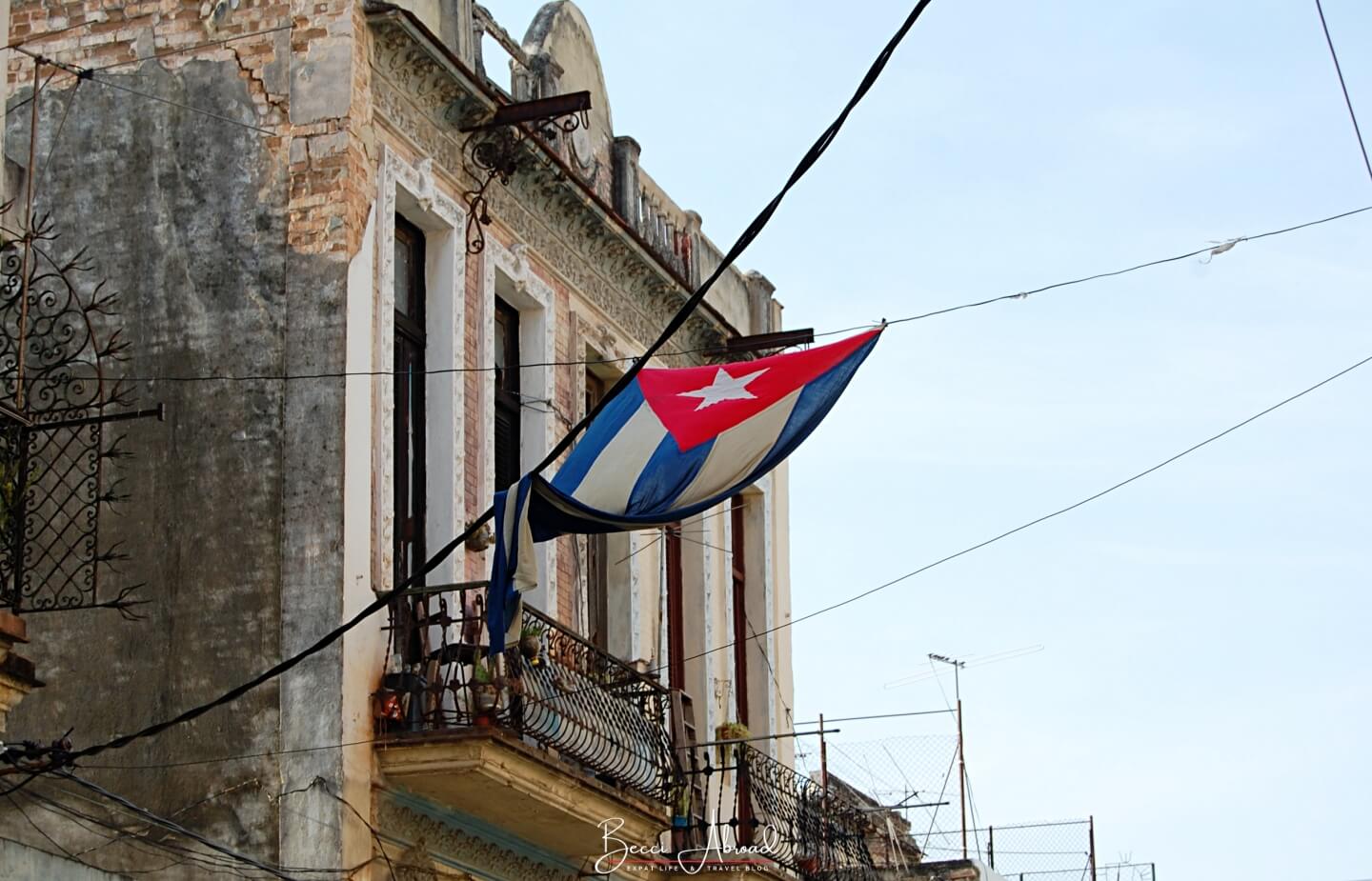 Cuban flag hanging over the streets of Havana - explore the best Cuban songs before you hit Havana