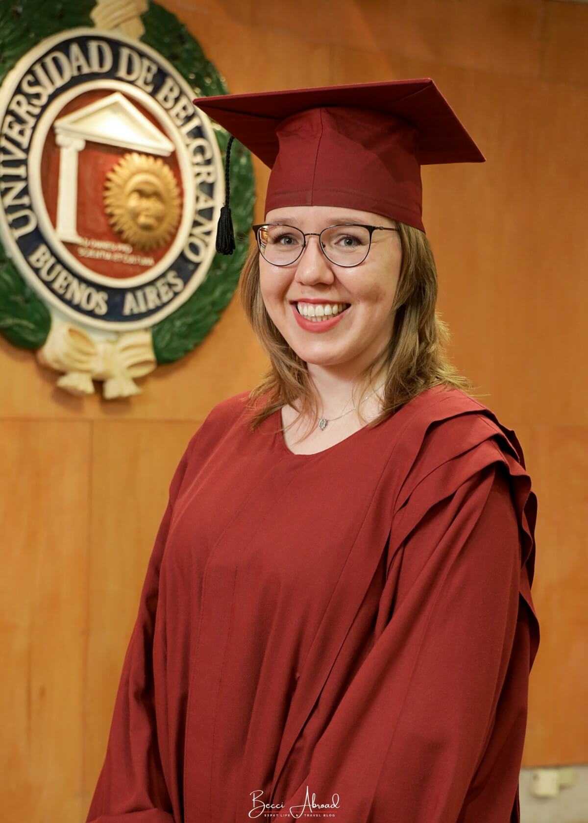 International student in traditional graduation gown from Universidad de Belgrano, Argentina