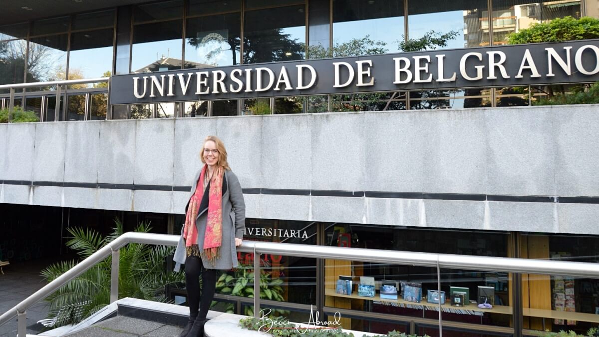 International student posing in front of Universidad de Belgrano - one of the many universities in Buenos Aires for studying abroad in Argentina