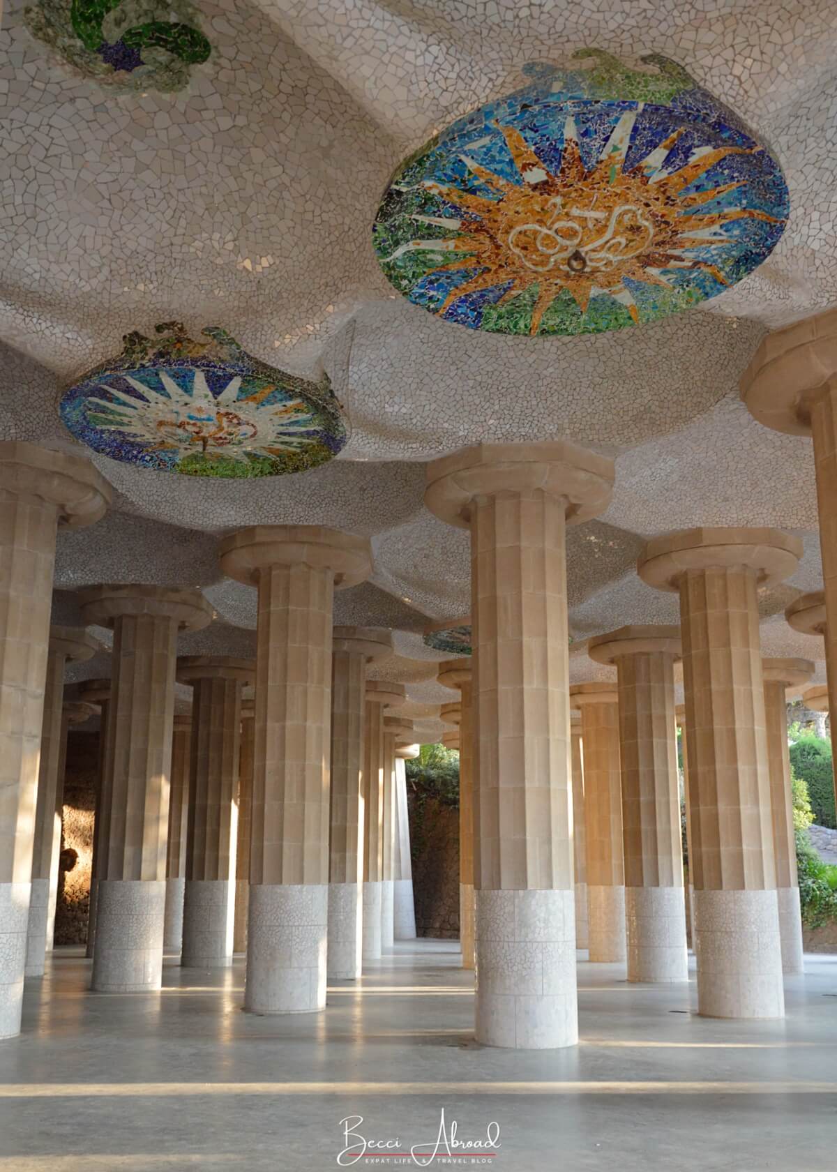 A detailed shot of the intricate ceiling mosaics inside the Hypostyle Hall at Park Güell, a testament to Gaudí’s artistic vision.