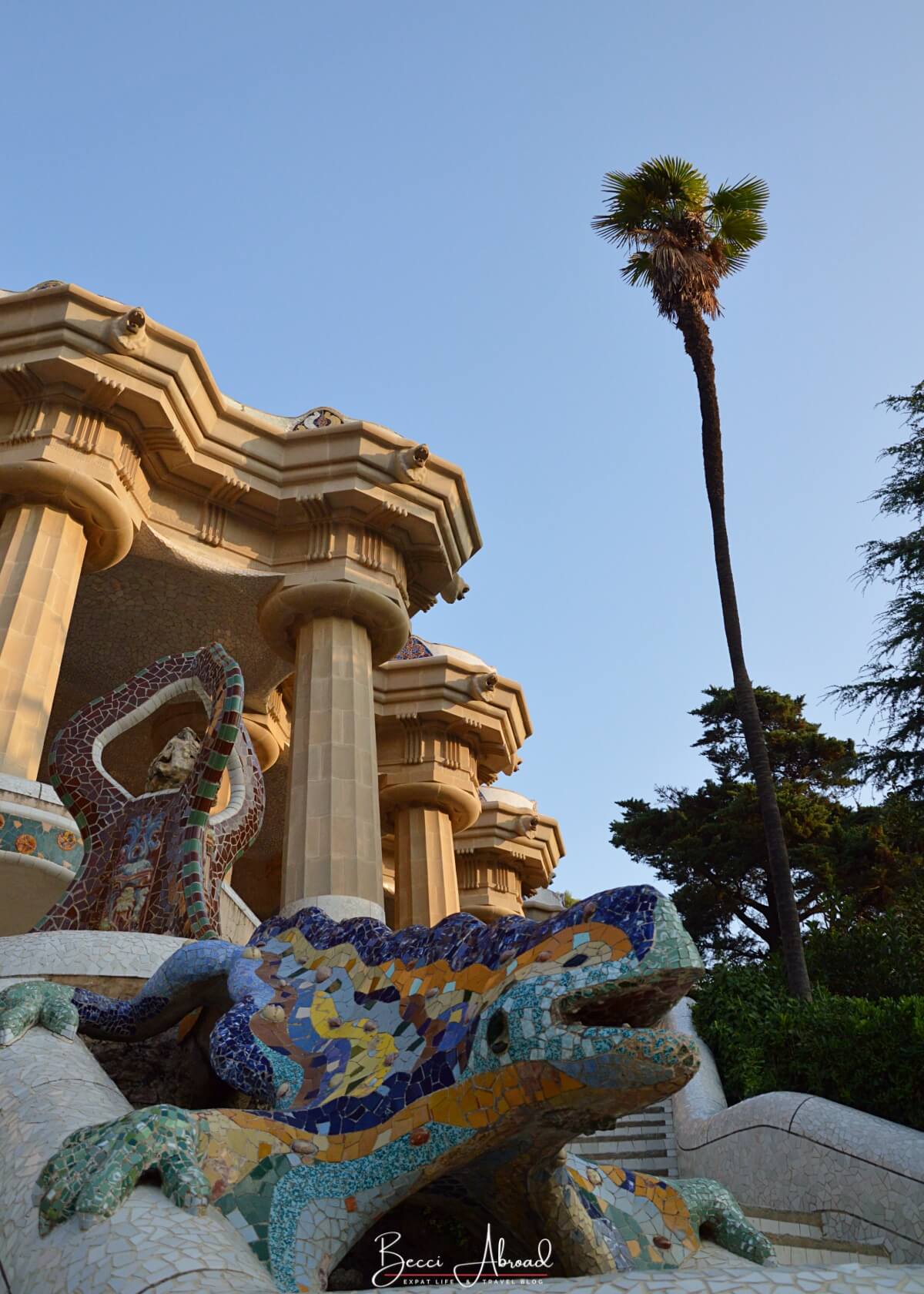 A mosaic dragon sculpture at the entrance of Park Güell in Barcelona, showcasing Gaudí’s vibrant design and intricate tile work.