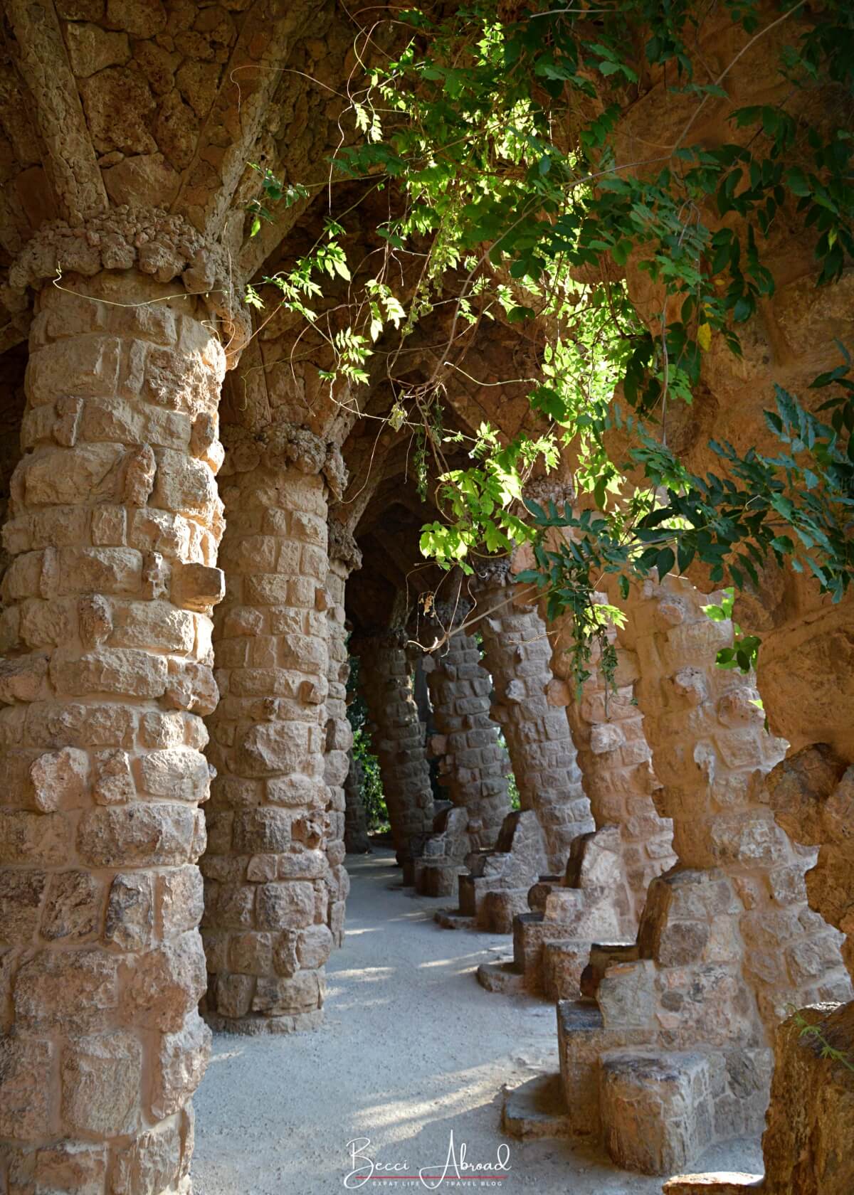 Inside Park Güell's viaducts, a cenic walkways supported by stone pillars designed by Gaudí.