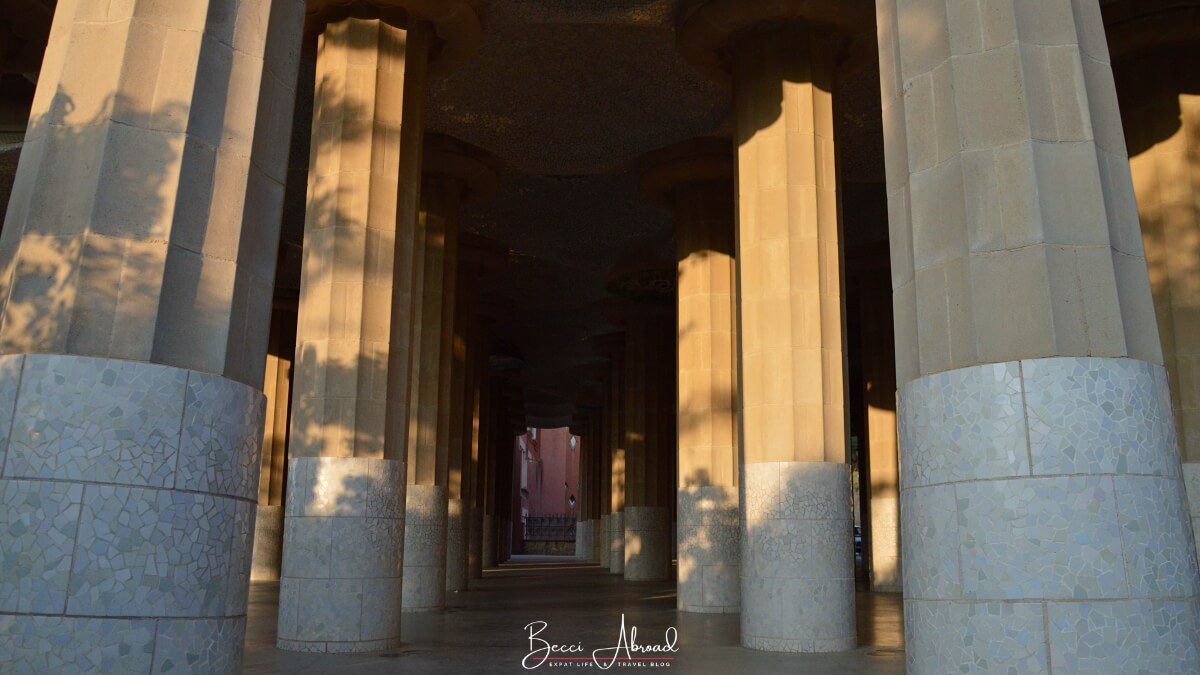 The majestic Doric columns of the Hypostyle Hall in Park Güell, designed to resemble a forest with tree-like structures.