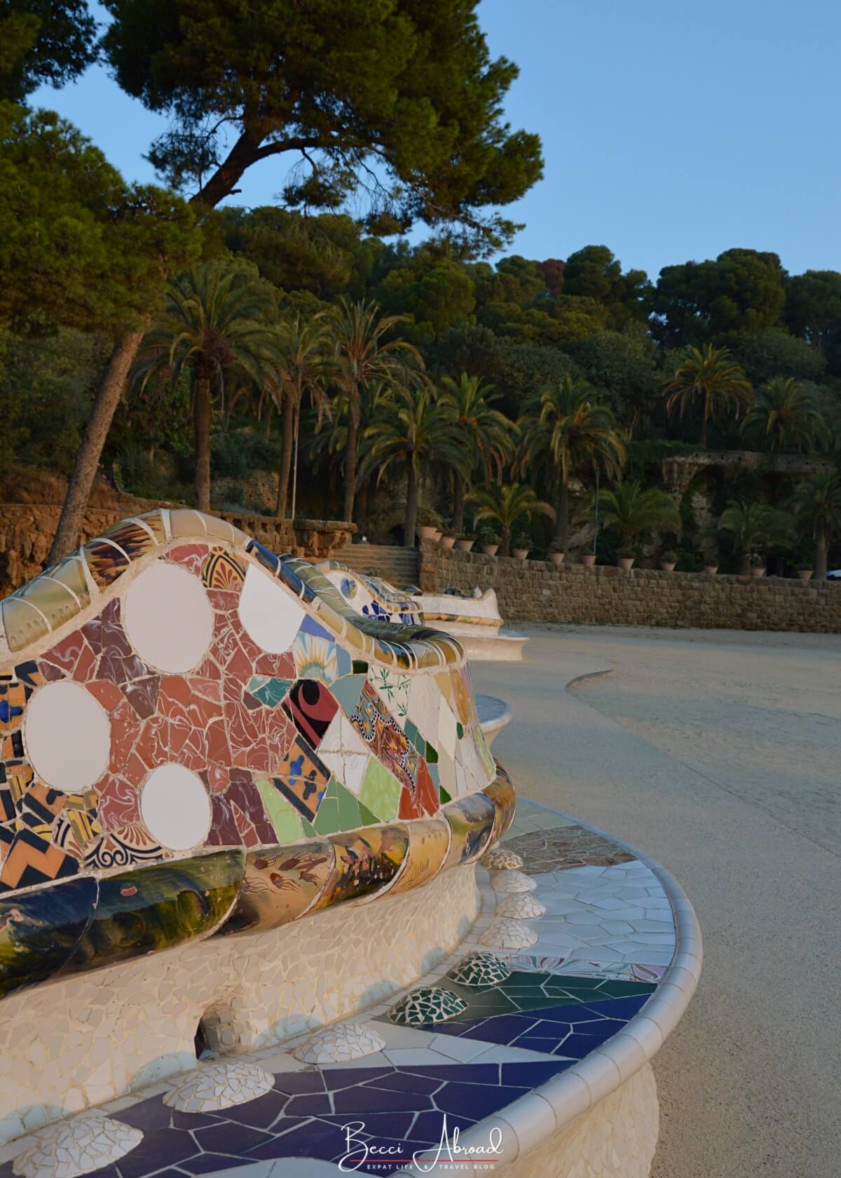 Things to do in Park Güell: Relax on the famous wavy bench and enjoy the view of the city skyline stretching to the Mediterranean Sea.