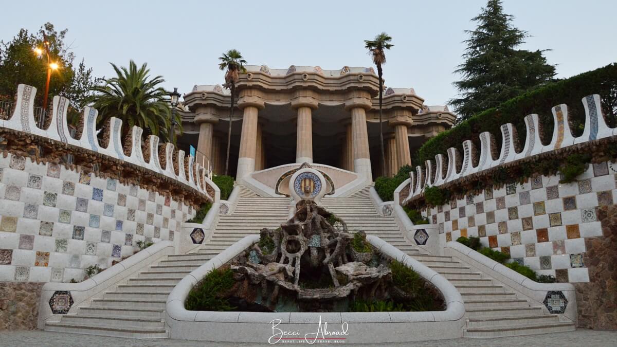 The Dragon Stairway in Park Güell in Barcelona, leading up to the Hypostyle Hall with its mosaic-covered salamander centerpiece.