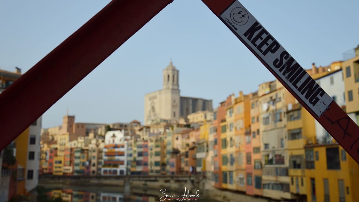 A sunset over Girona with its skyline silhouetted against the sky