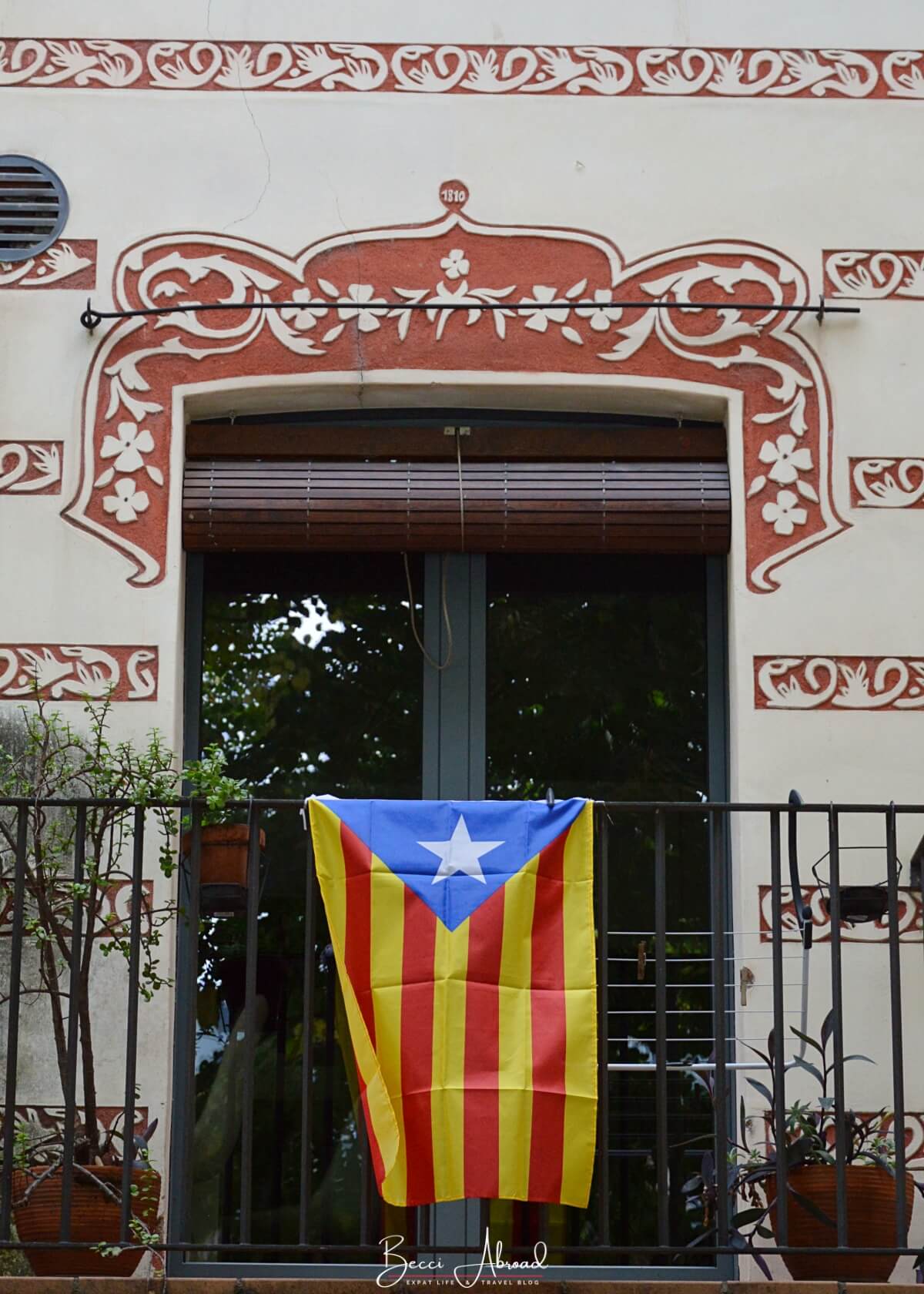 Catalan flag hanging from the balcony of a traditional Catalan house in Girona