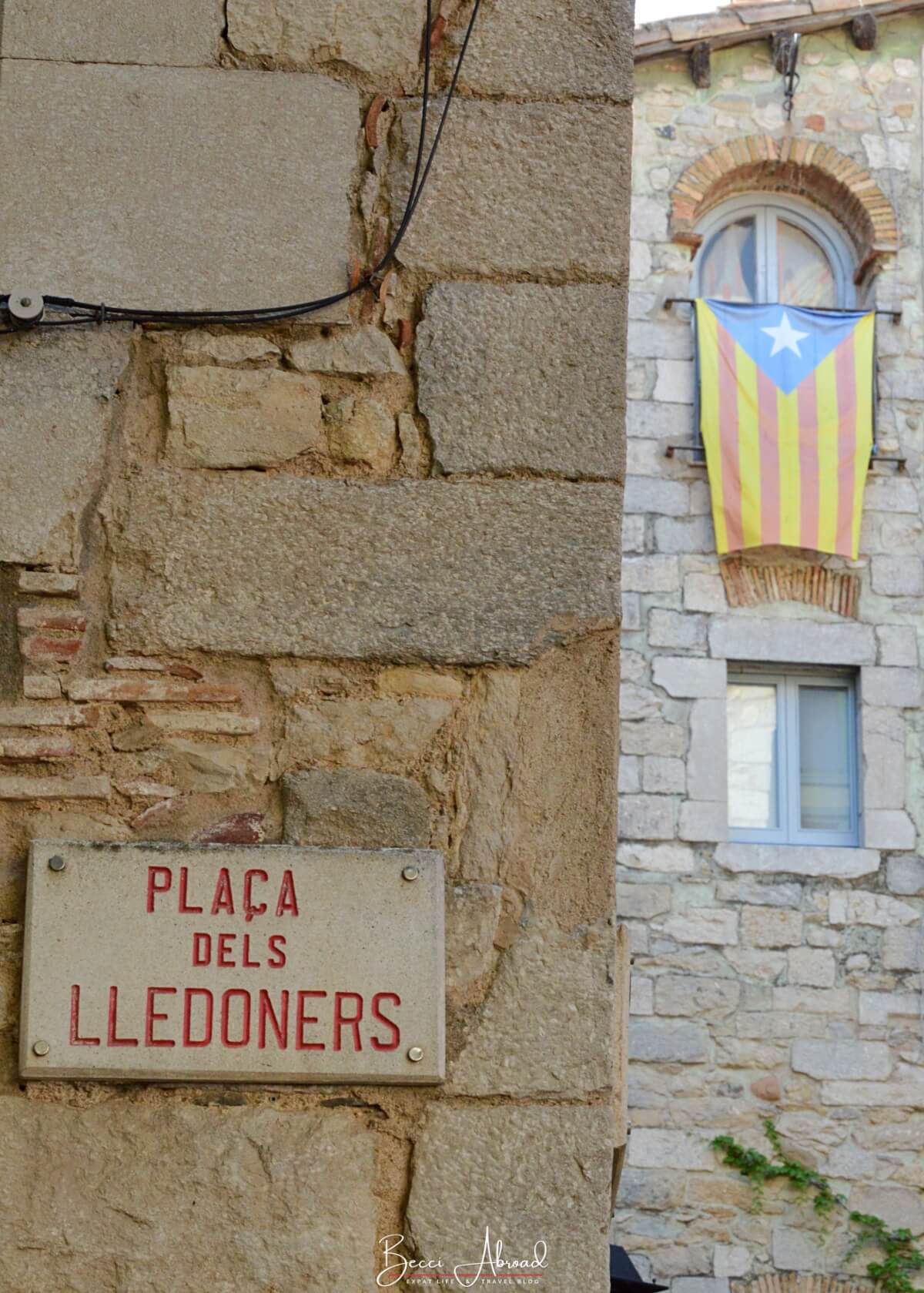 Stone walls and Catalan flag in Girona, Catalonia