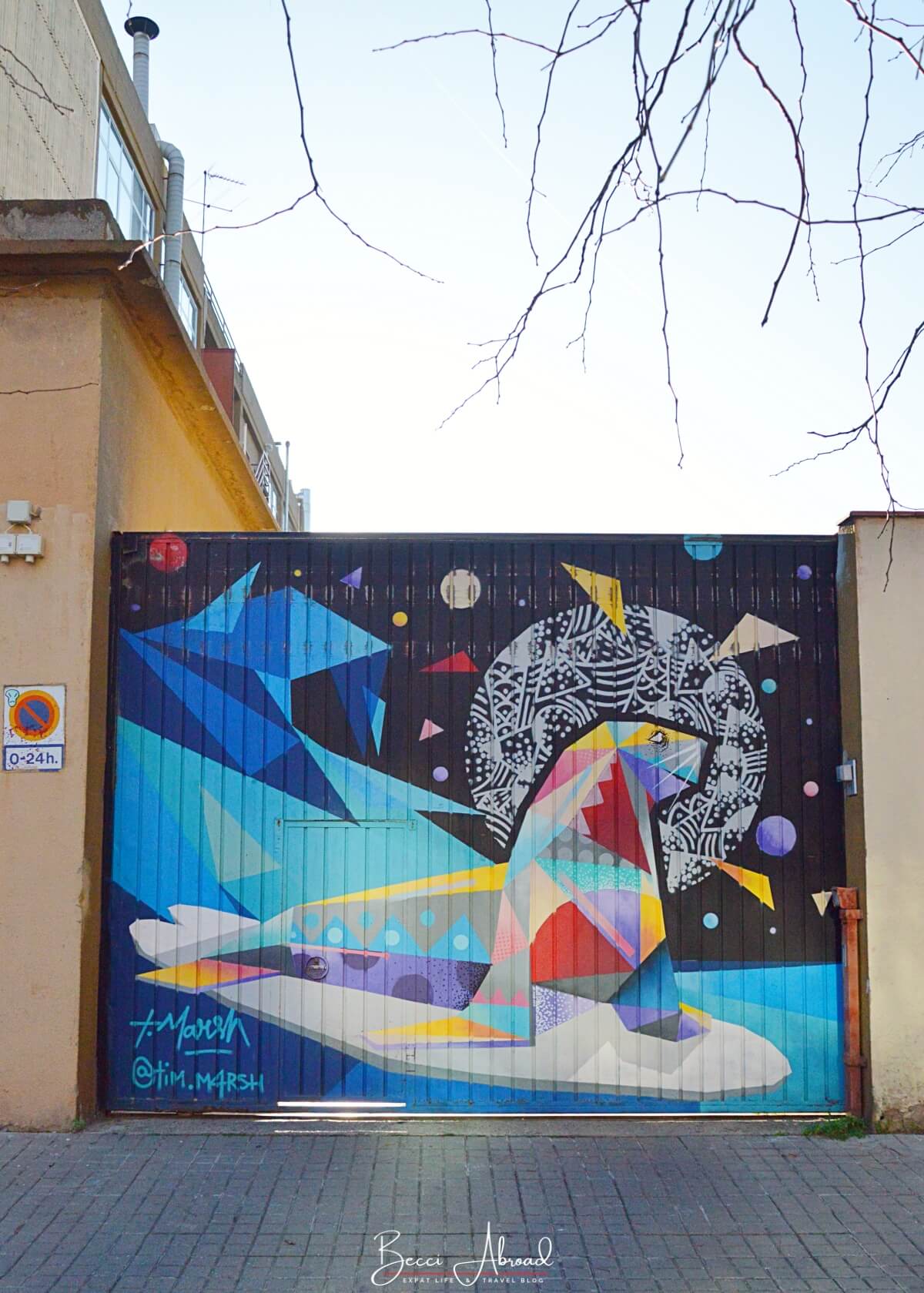 Street art mural of a colorful geometric seal by Tim Marsh in Poblenou Barcelona