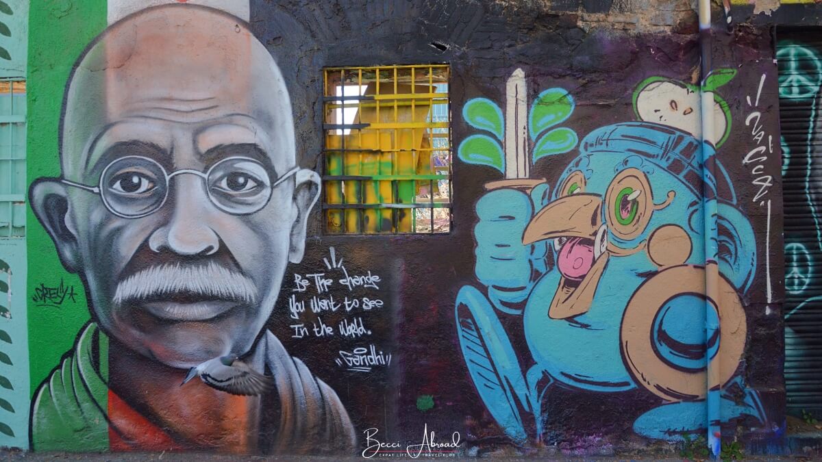 Poblenou Street art mural with Gandhi and a cartoon bird