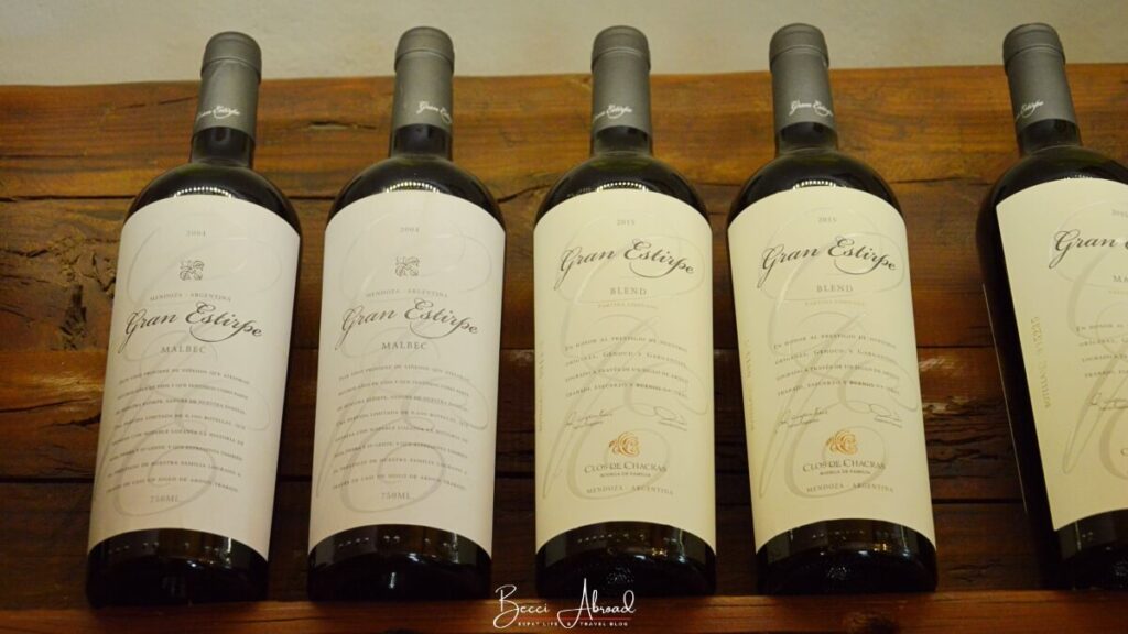 Bottles of Malbec wines on a shelves in a winery in Luján de Cuyo.