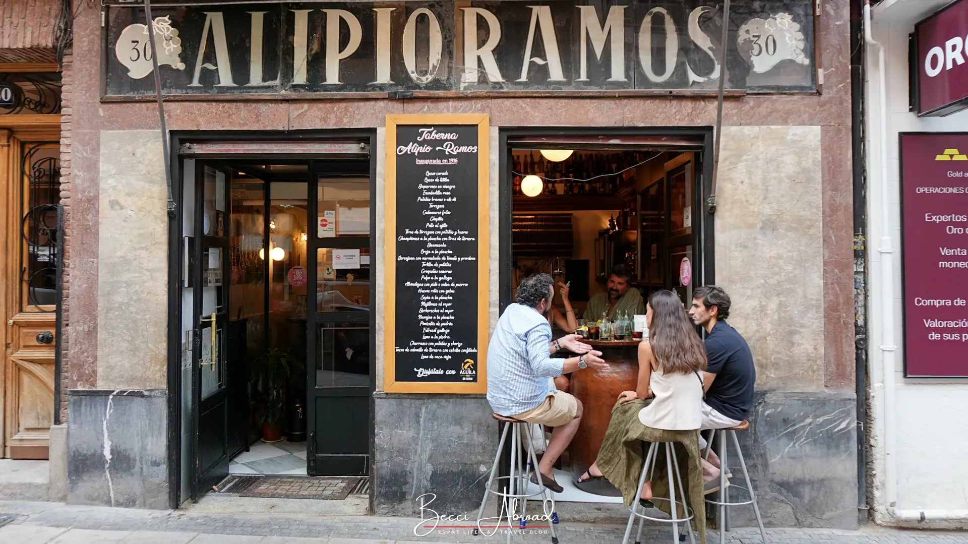 People chatting outside a tapas bar in Madrid