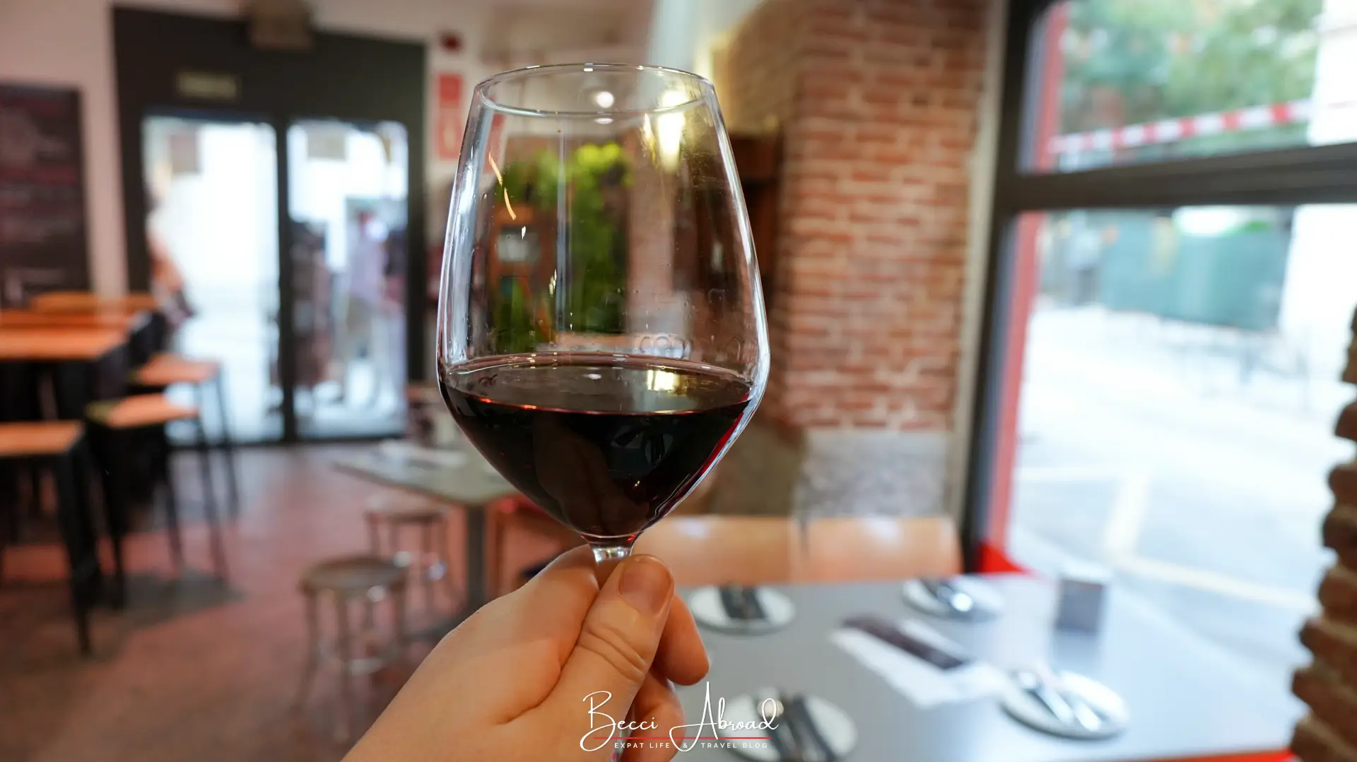 Glass of red wine on a non-touristy tapas tour in Madrid
