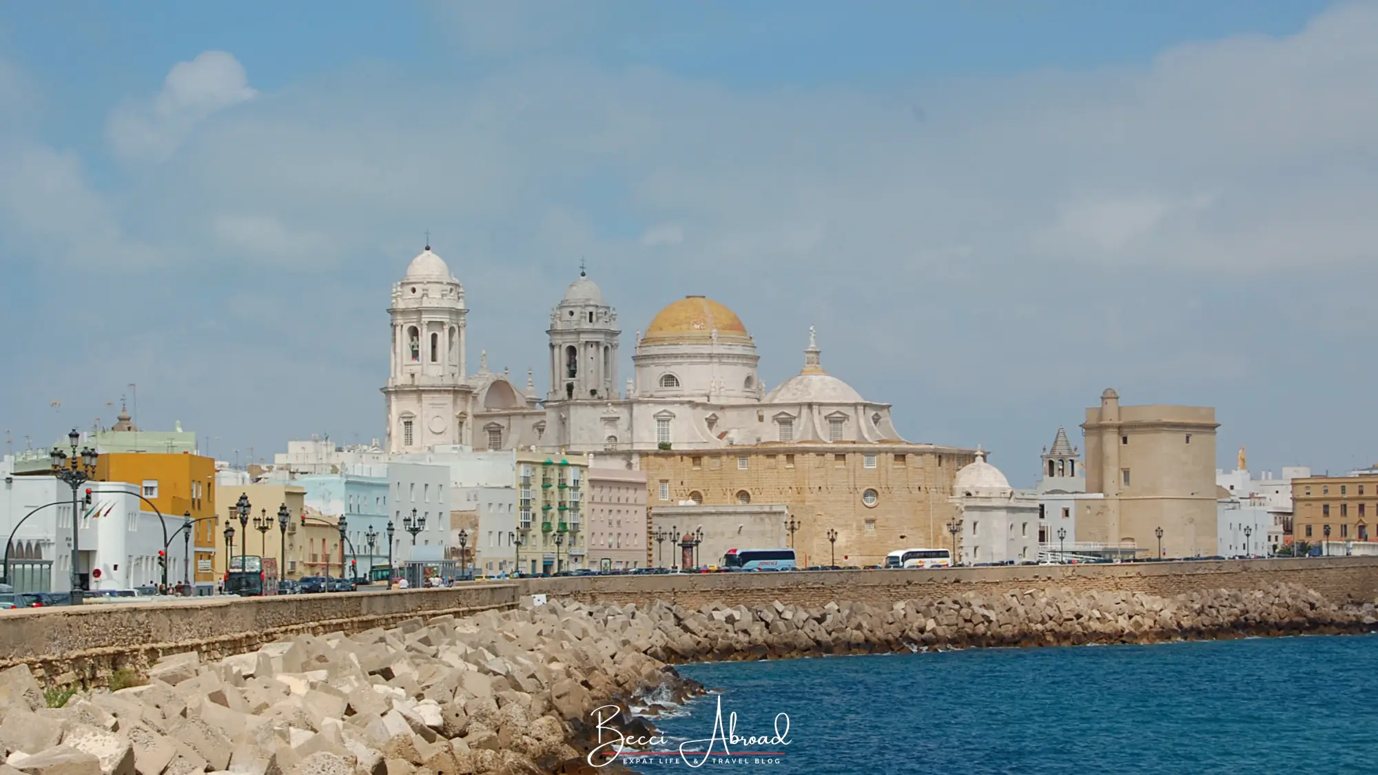 Cádiz Cathedral and its golden dome seen from the seafront on a sunny winter day