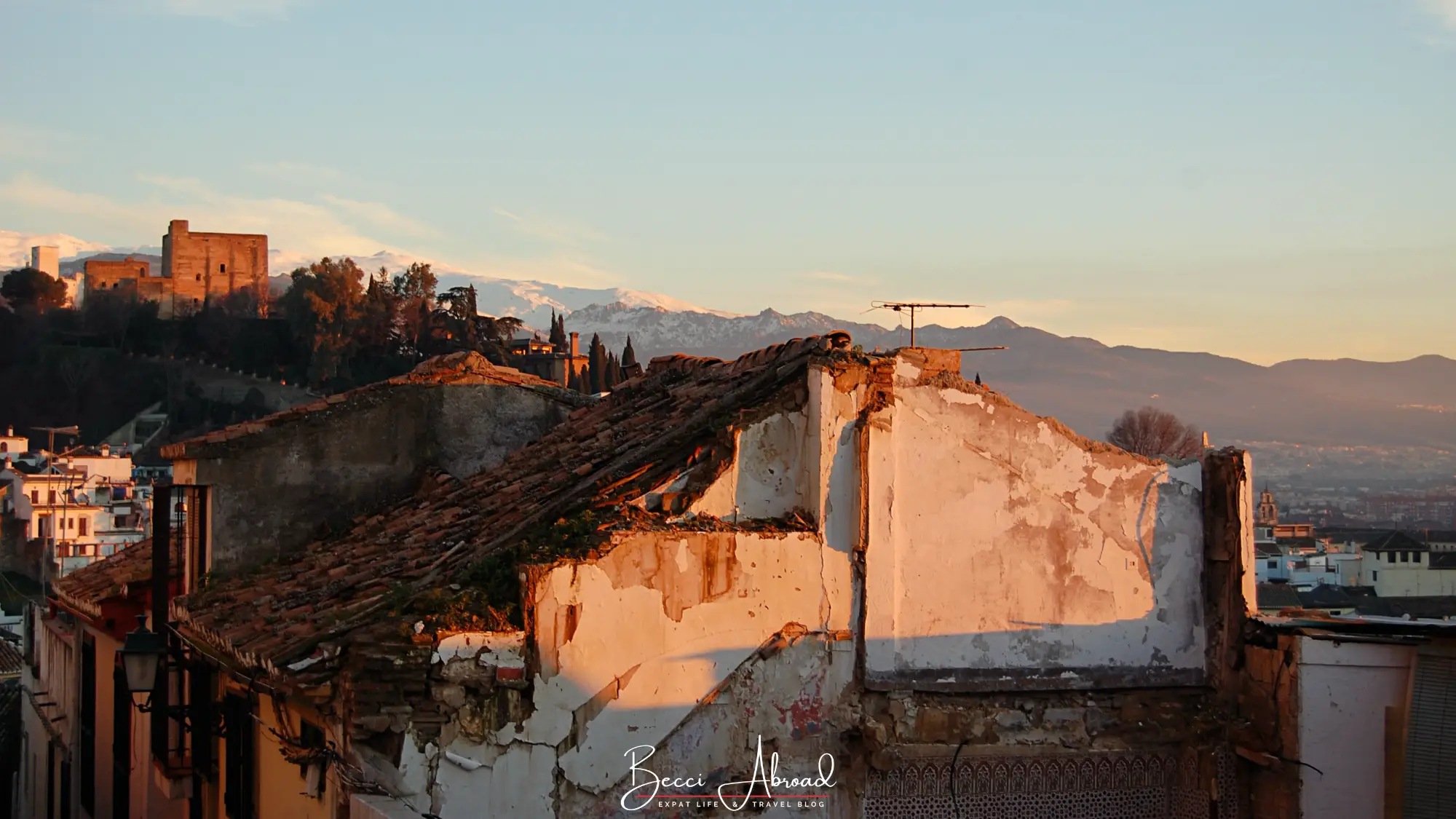Winter sunset over Granada with the Sierra Nevada mountains behind