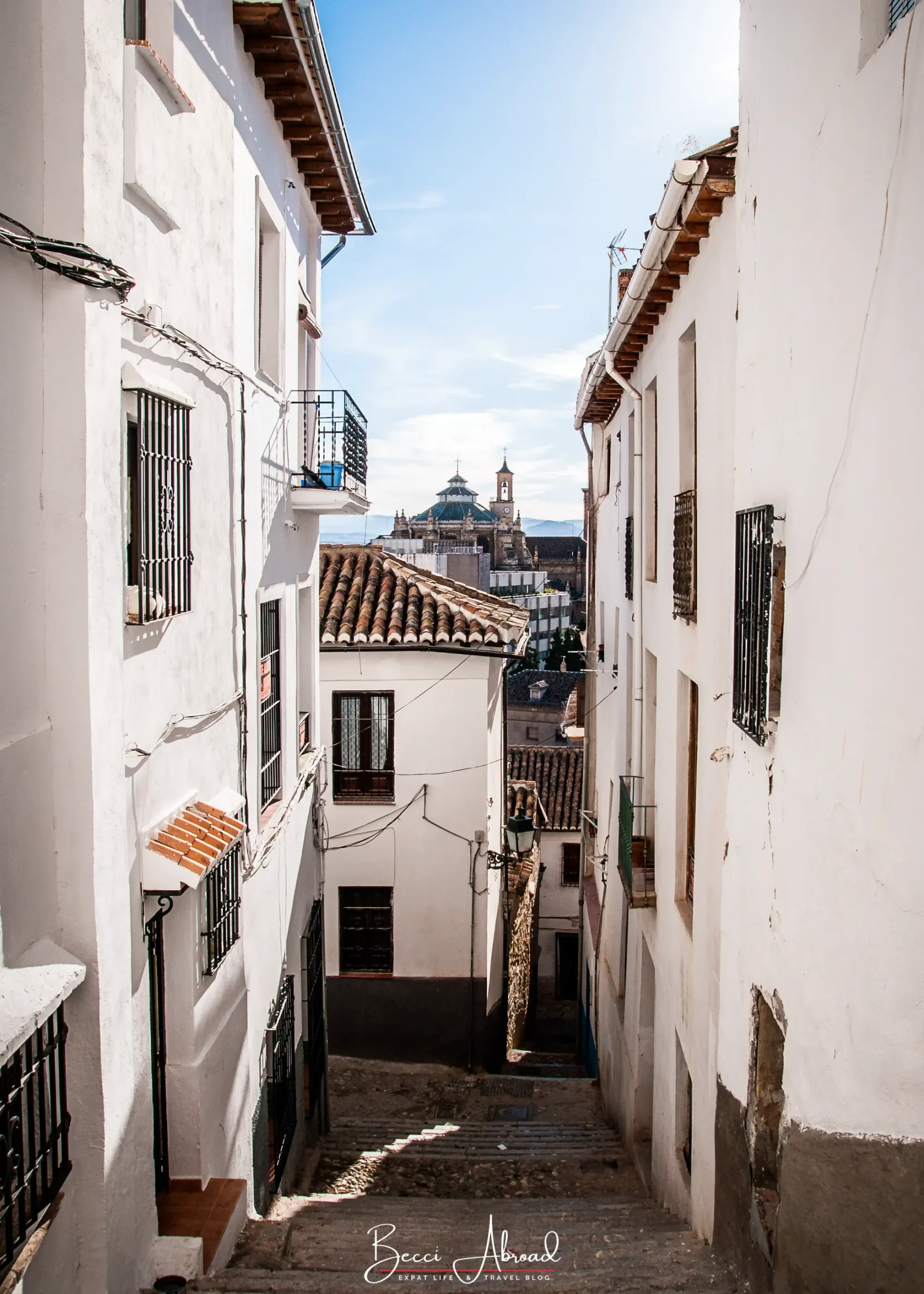 Narrow whitewashed street in Granada’s old town in winter