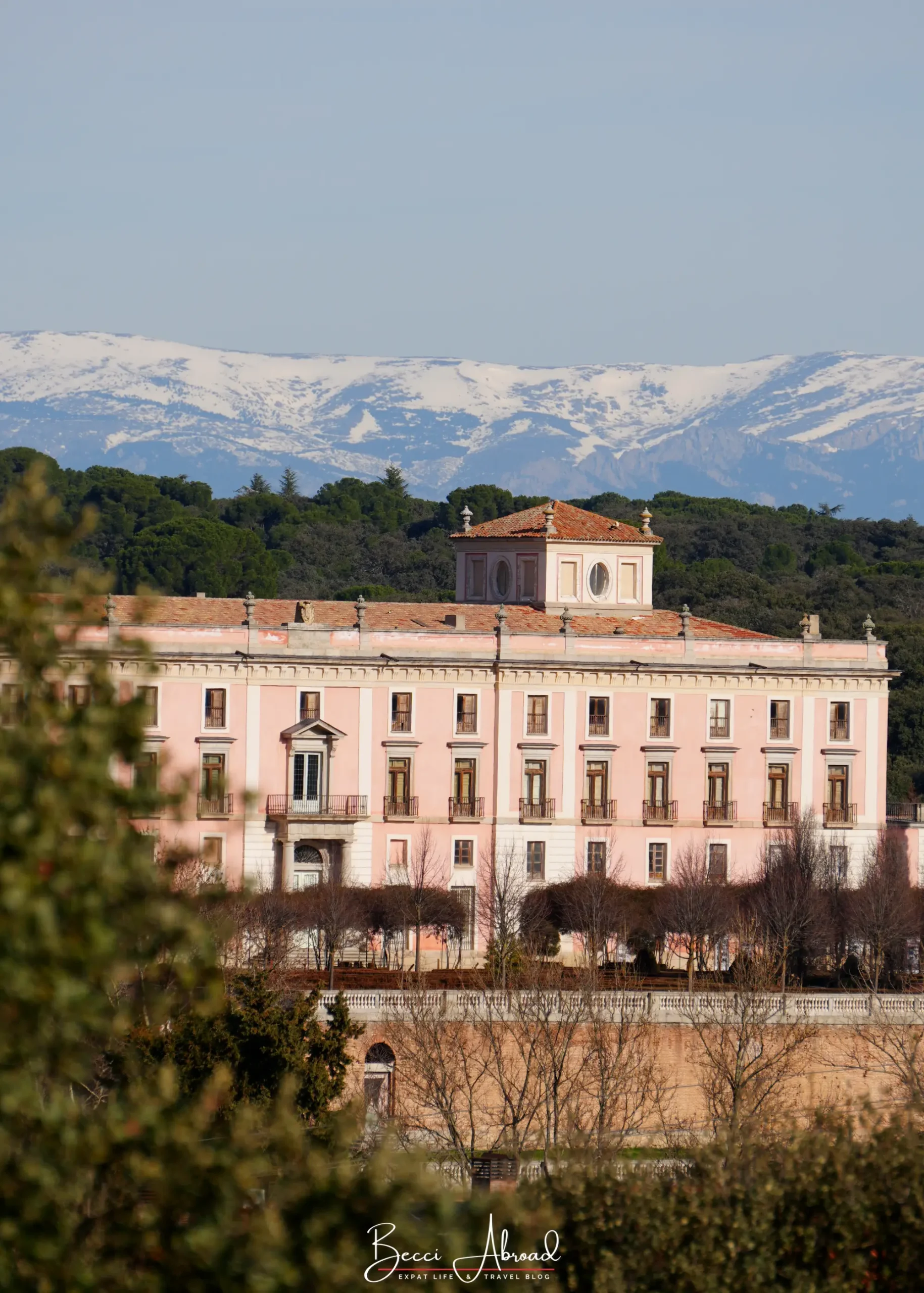 Palace in Boadilla del Monte, Madrid, with snowy mountains in the background